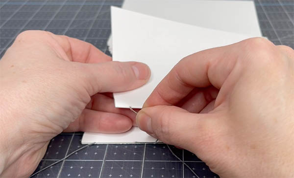 enter the second signature through the first sewing station at the top parallel to where you left off below